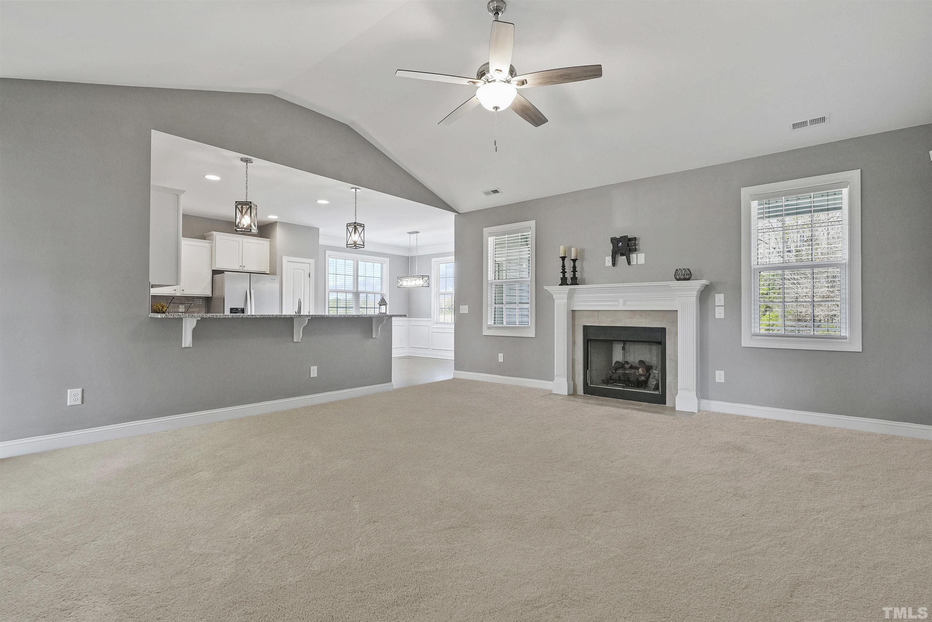 4085 Old 75 Highway Stem, NC 27581 - Photo 7 of 36 a view of empty room with a fireplace and window