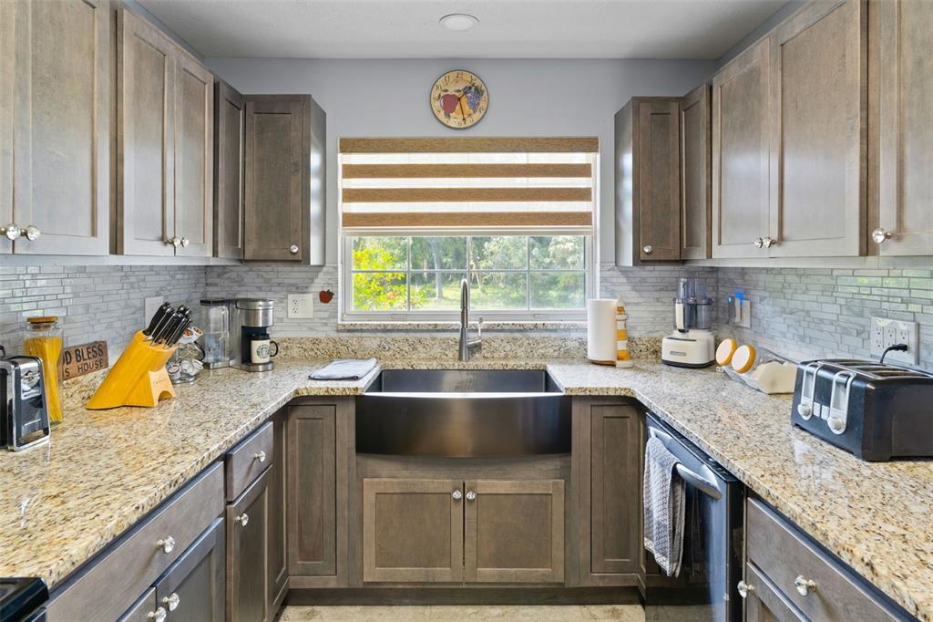 965 North Appalachian Terrace Crystal River, FL 34429 - Photo 13 of 65 a kitchen with a sink stove and cabinets