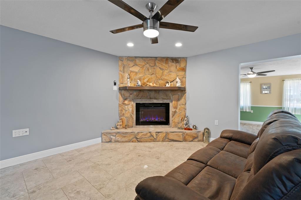 965 North Appalachian Terrace Crystal River, FL 34429 - Photo 18 of 65 a living room with furniture and a fireplace
