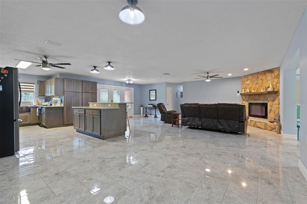 965 North Appalachian Terrace Crystal River, FL 34429 - Photo 20 of 65 a large room with furniture and a chandelier