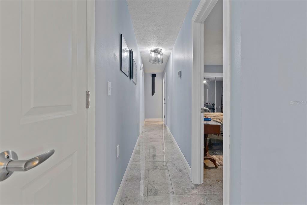 965 North Appalachian Terrace Crystal River, FL 34429 - Photo 25 of 65 a view of a hallway with wooden floor and a bathroom