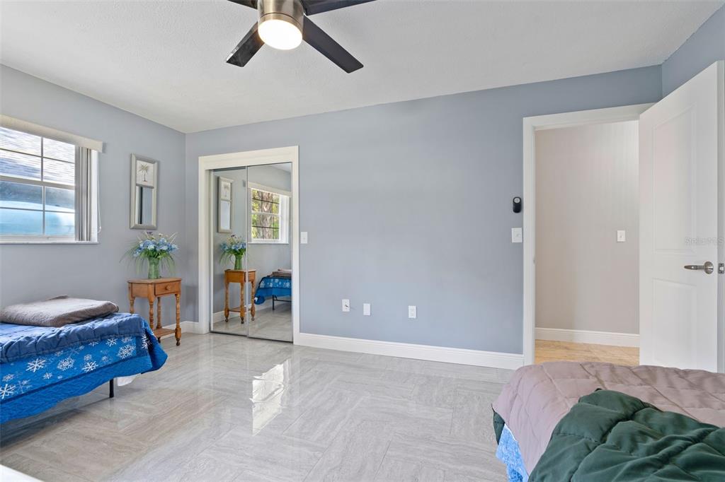 965 North Appalachian Terrace Crystal River, FL 34429 - Photo 37 of 65 a bedroom with a bed and a chandelier