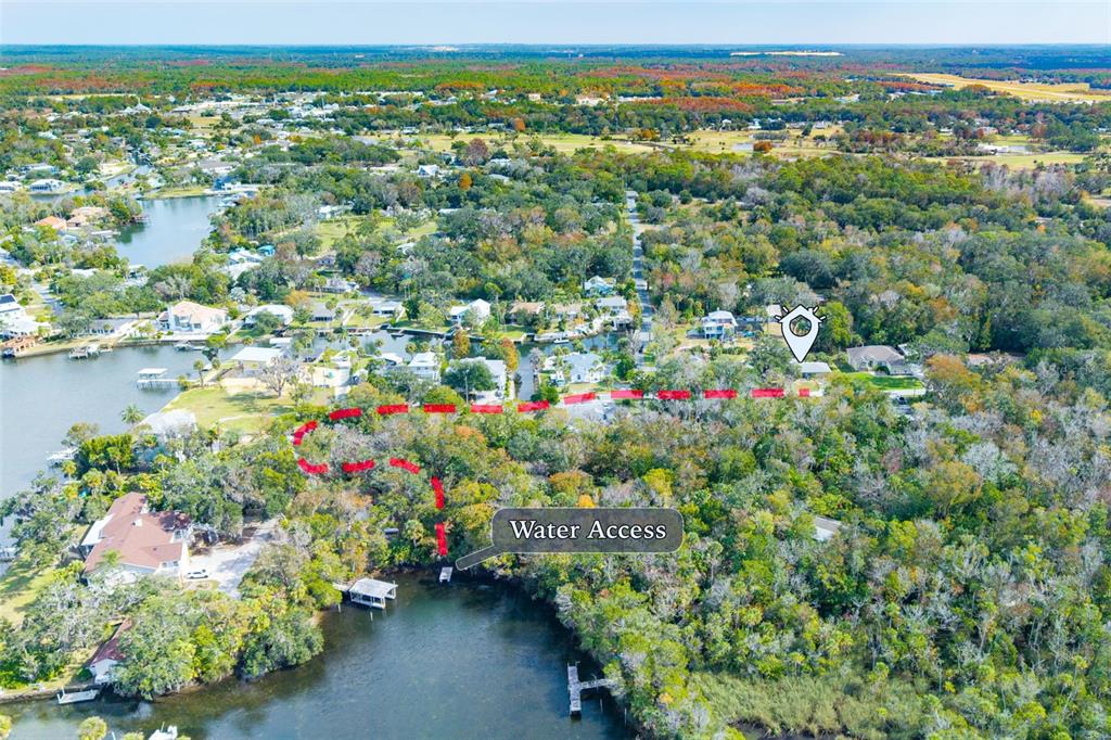 965 North Appalachian Terrace Crystal River, FL 34429 - Photo 5 of 65 an aerial view of a houses with a yard and lake view