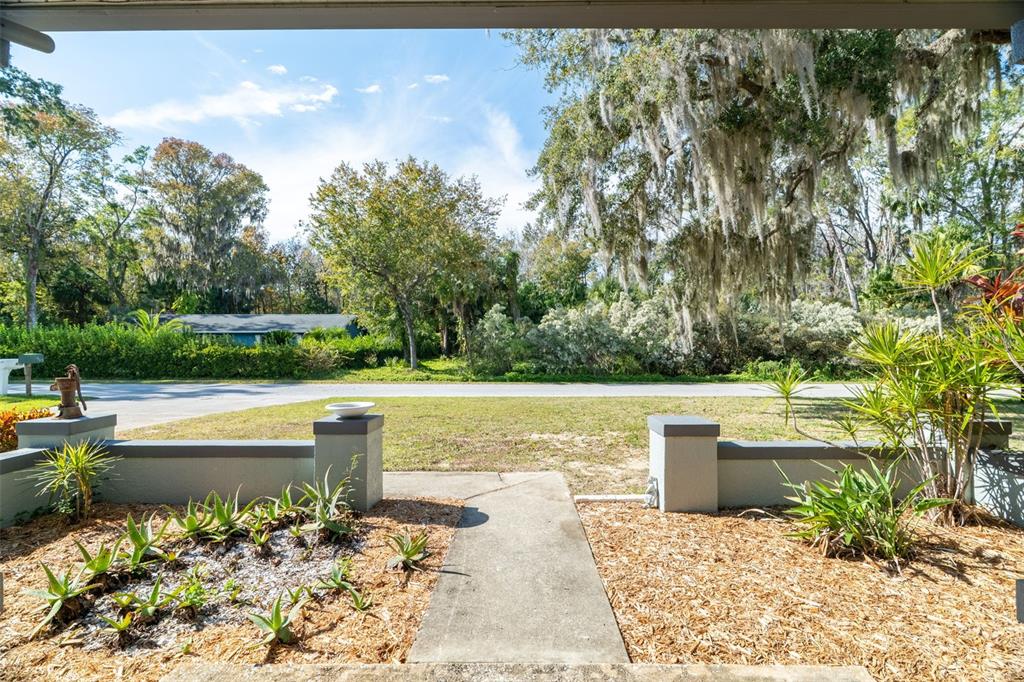 965 North Appalachian Terrace Crystal River, FL 34429 - Photo 7 of 65 a view of a lake with a house in the background
