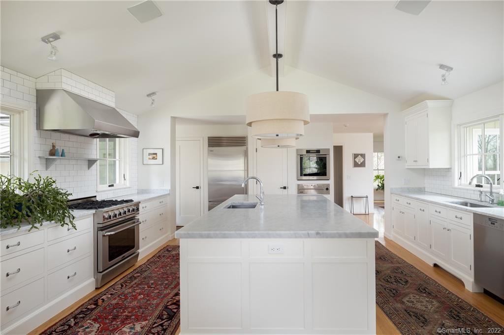 115 Jackson Road Sharon, CT 06069 - Photo 1 of 1 a kitchen with granite countertop stainless steel appliances a stove sink and cabinets