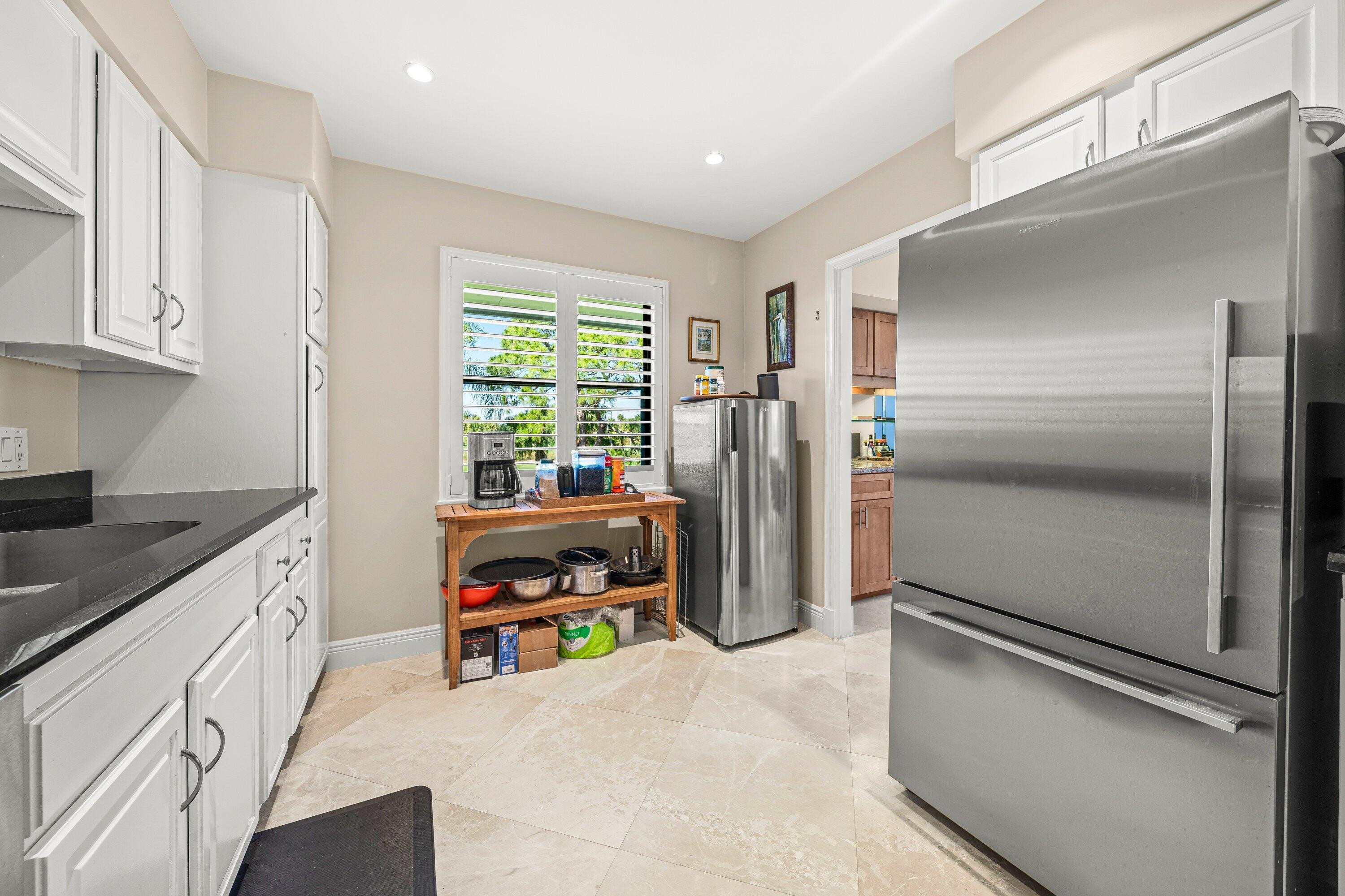 10221 Quail Covey Road, Unit HIBISCUS S Boynton Beach, FL 33436 - Photo 14 of 60 Kitchen w/ stand alone freezer