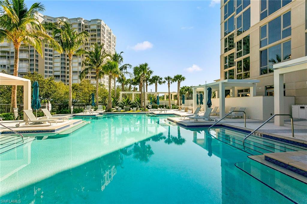 6897 Grenadier Boulevard, Unit 207 Naples, FL 34108 - Photo 20 of 27 a view of a house with swimming pool and sitting area