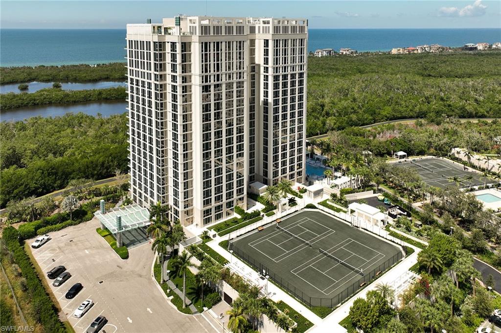 6897 Grenadier Boulevard, Unit 207 Naples, FL 34108 - Photo 2 of 27 a view of multiple houses