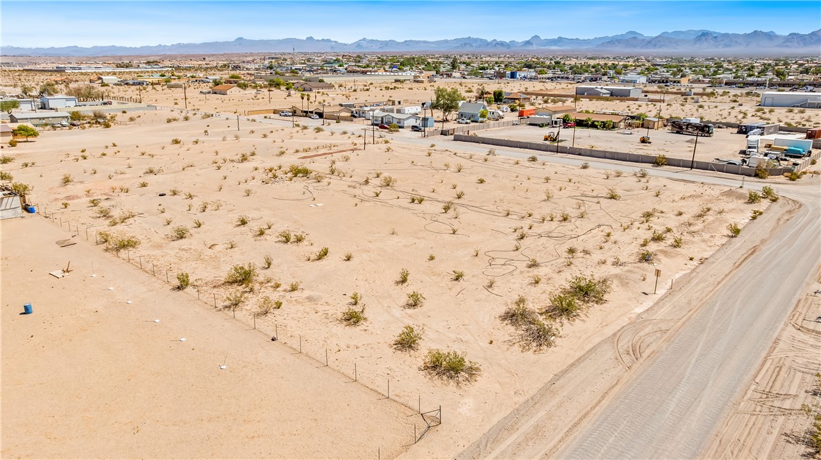 4495 Cavalry Road Fort Mohave, AZ 86426 - Photo 5 of 11 Aerial view of residential area featuring mountains and a desert landscape