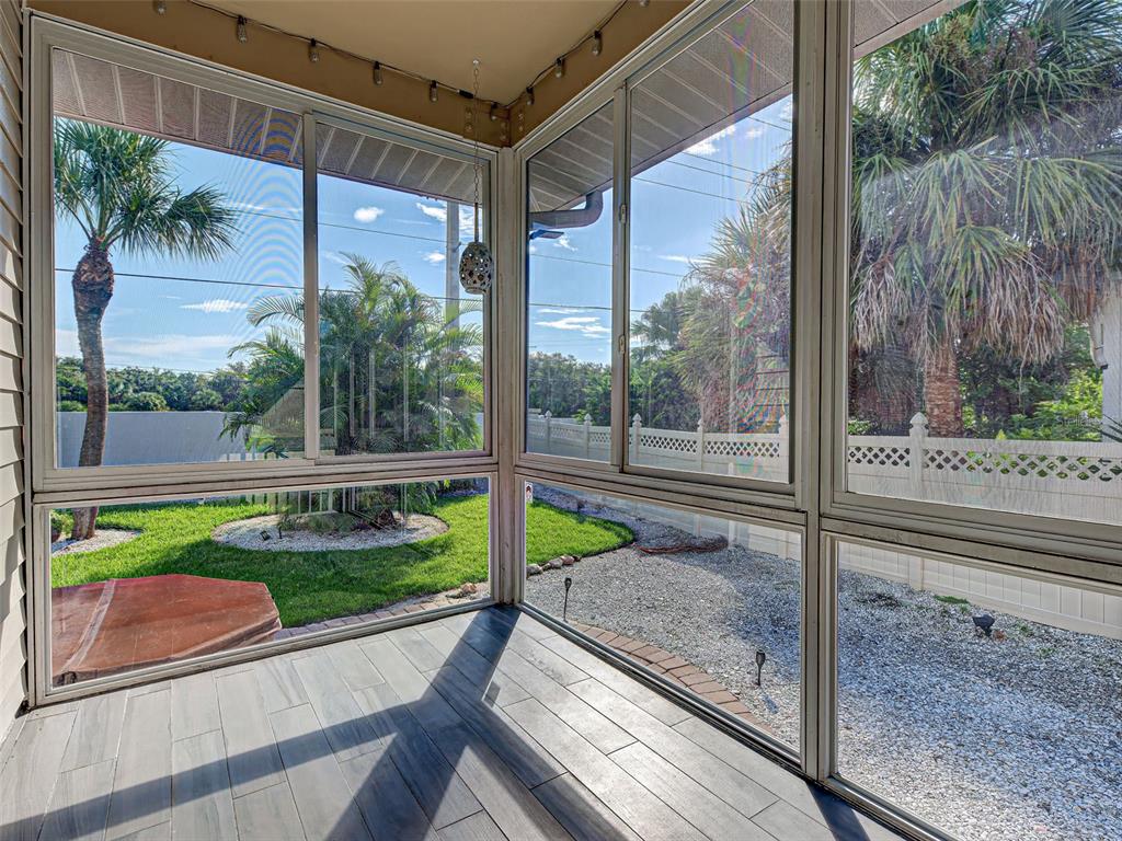 1801 Highland Road Osprey, FL 34229 - Photo 31 of 40 a view of a porch with a yard