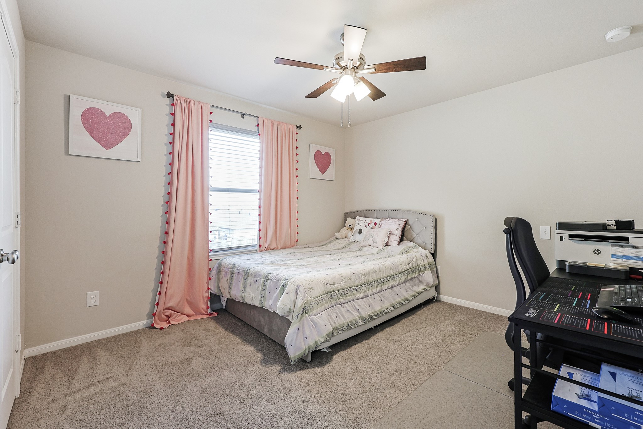 10423 Rochester Hls Lane Tomball, TX 77375 - Photo 24 of 36 This charming, well-proportioned secondary bedroom provides a comfortable and private space for family members, guests, or an ideal dedicated home office.