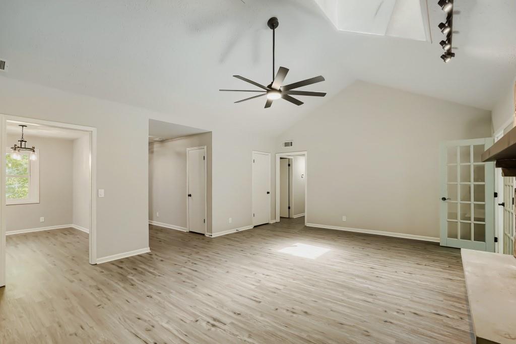 2021 Irwin Bridge Road Northwest Conyers, GA 30012 - Photo 20 of 43 wooden floor in an empty room with a window