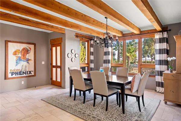 a view of a dining room with furniture and window