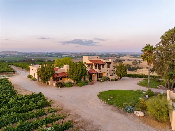 an aerial view of a house with a garden