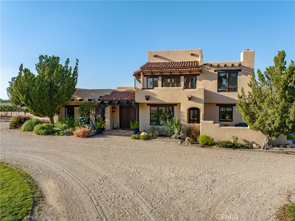 an aerial view of a house with a lake view