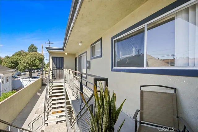 an aerial view of a residential houses with outdoor space