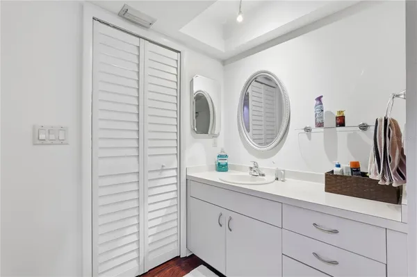 a bathroom with a sink and a mirror