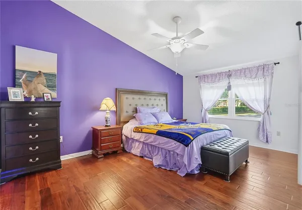 a bedroom with a bed and a dresser