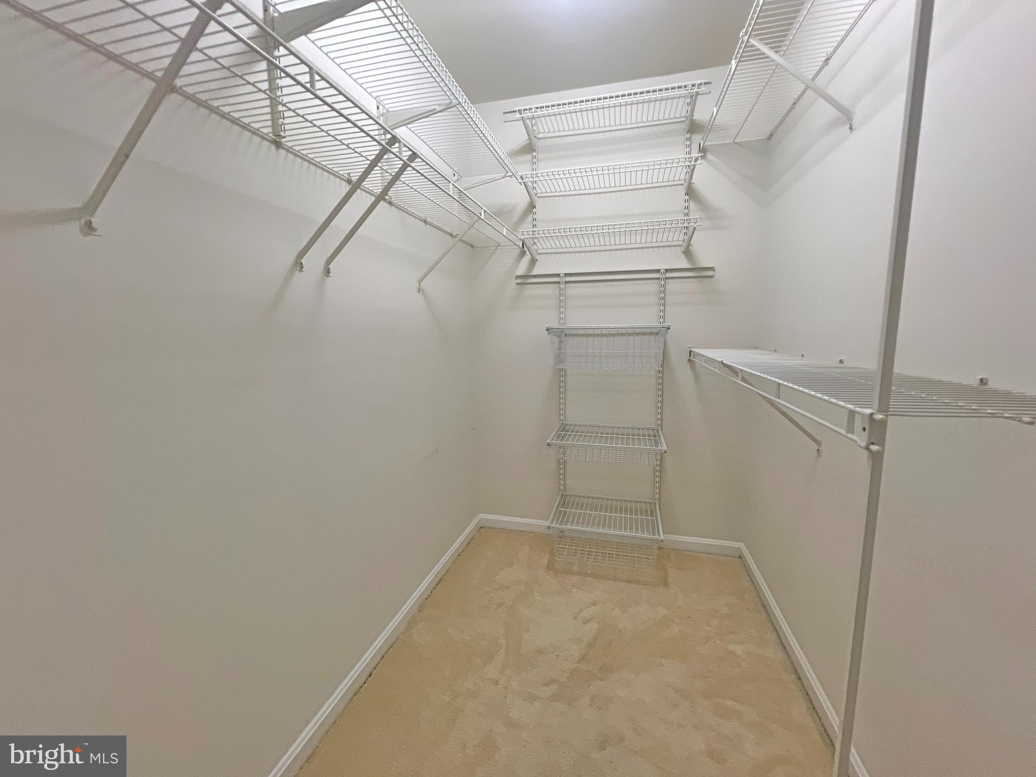 1191 Cypress Tree Place Herndon, VA 20170 - Photo 15 of 18 a view of a room with racks on the wall