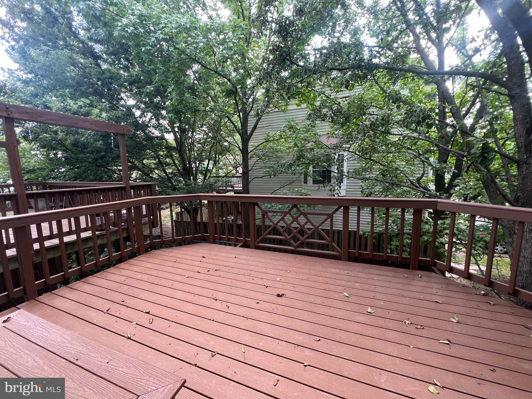 1191 Cypress Tree Place Herndon, VA 20170 - Photo 16 of 18 a view of deck with wooden floor and fence