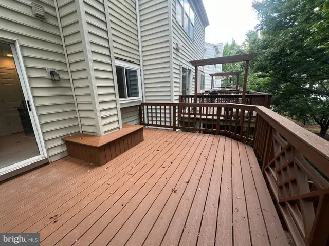 a view of deck with wooden floor and fence