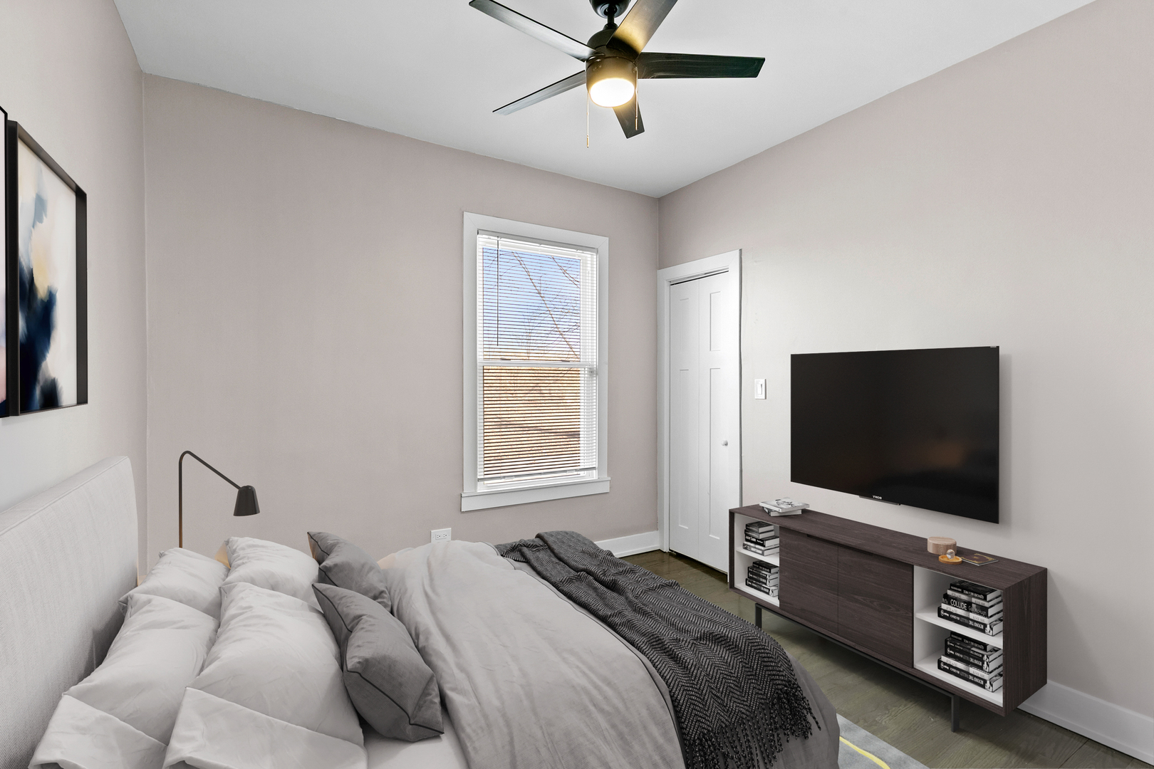 7501 South Morgan Street Chicago, IL 60620 - Photo 13 of 24 a bedroom with a bed and a flat screen tv