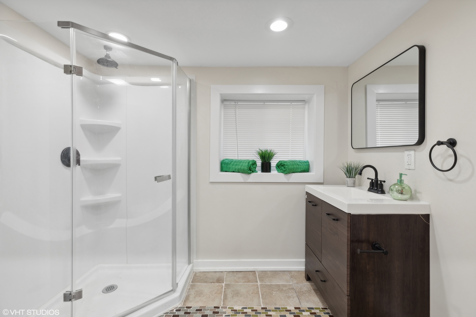 7501 South Morgan Street Chicago, IL 60620 - Photo 17 of 24 a bathroom with a shower sink vanity and mirror