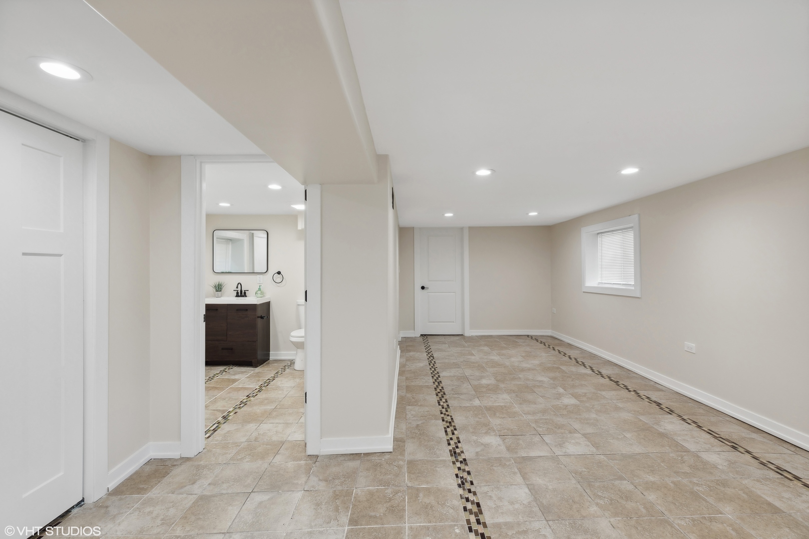 7501 South Morgan Street Chicago, IL 60620 - Photo 20 of 24 a view of a big room with windows and chandelier