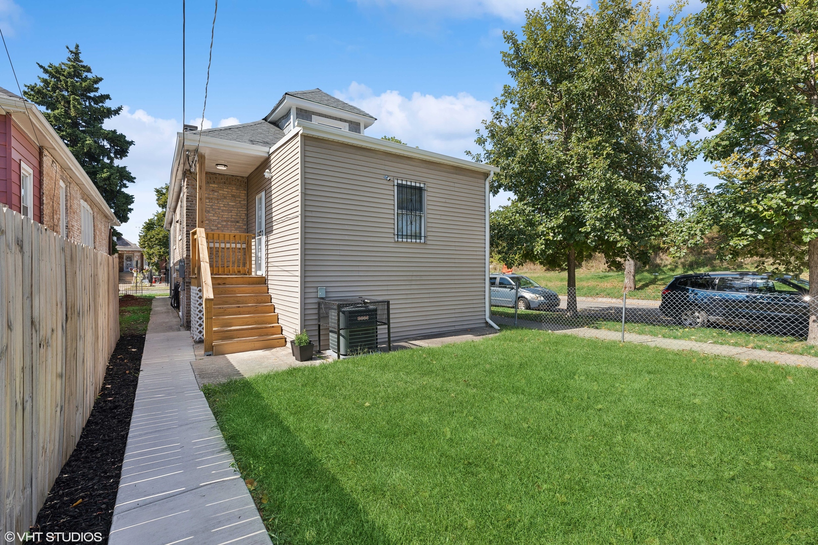 7501 South Morgan Street Chicago, IL 60620 - Photo 23 of 24 a view of a house with backyard and a tree