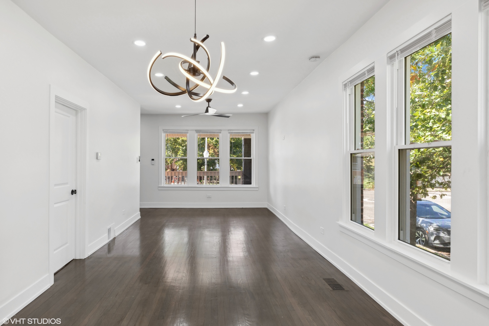 7501 South Morgan Street Chicago, IL 60620 - Photo 3 of 24 a view of an room with wooden floor and windows