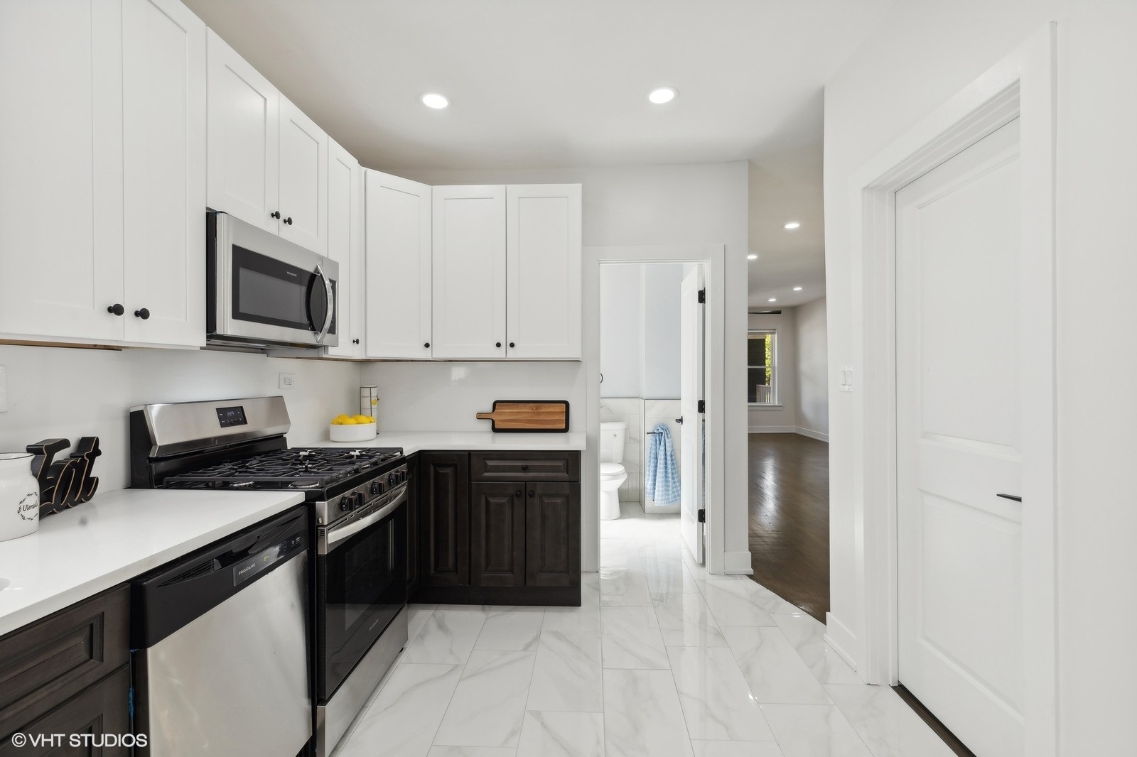 7501 South Morgan Street Chicago, IL 60620 - Photo 6 of 24 a kitchen with stainless steel appliances granite countertop a refrigerator and a stove top oven