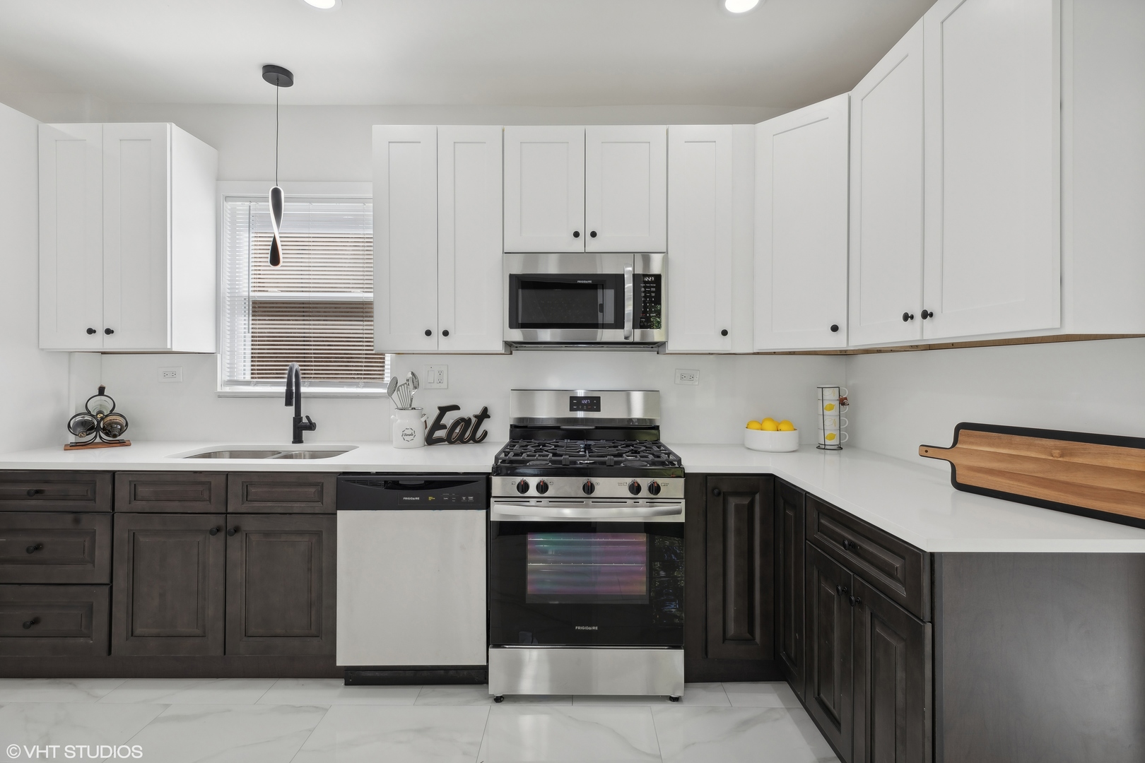 7501 South Morgan Street Chicago, IL 60620 - Photo 7 of 24 a kitchen with cabinets stainless steel appliances and a sink