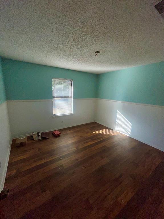 925 42nd Street Southwest Paris, TX 75460 - Photo 11 of 14 a view of a room with wooden floor and window