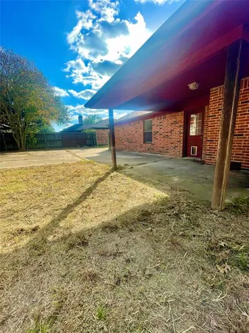 a view of an empty room with a fireplace
