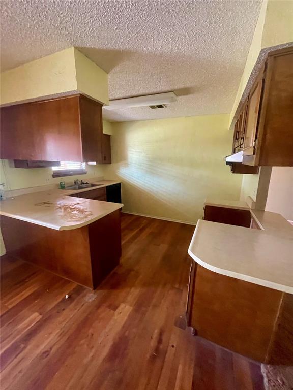 925 42nd Street Southwest Paris, TX 75460 - Photo 8 of 14 a room with wooden floor