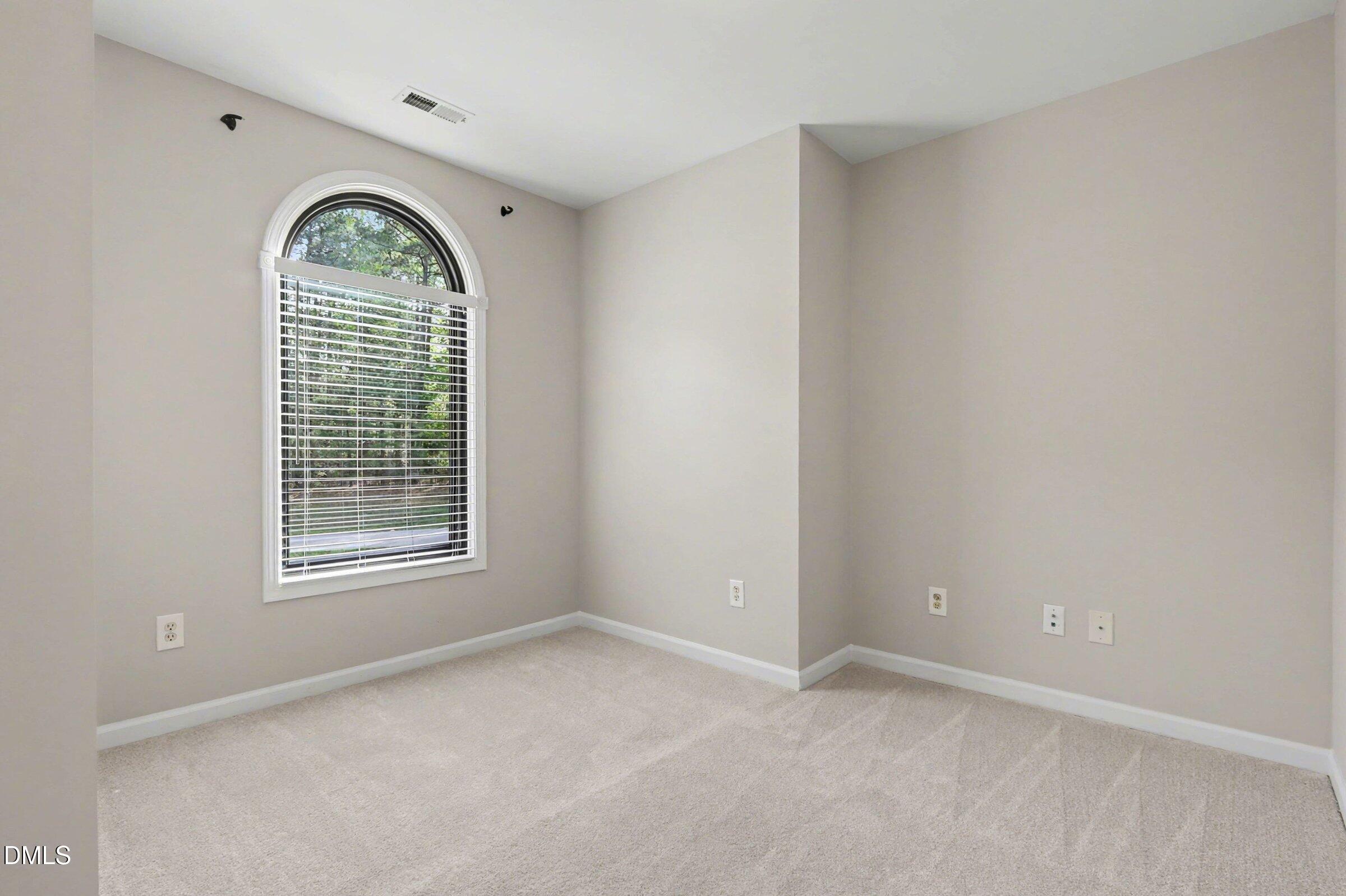 1001 Denfield Court Raleigh, NC 27615 - Photo 26 of 44 a view of an empty room with a window