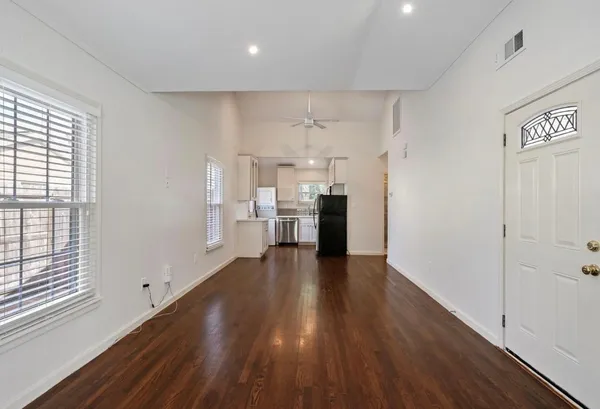 a view of kitchen with furniture and wooden floor