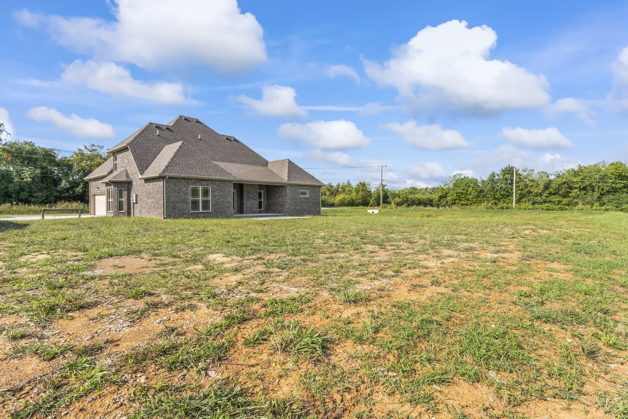 810 Walnut Grove Road Christiana, TN 37037 - Photo 3 of 18 a view of a large garden with a small yard