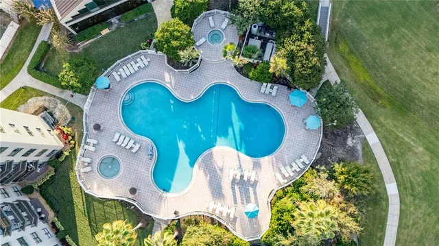 aerial view of a wooden chairs and fire pit