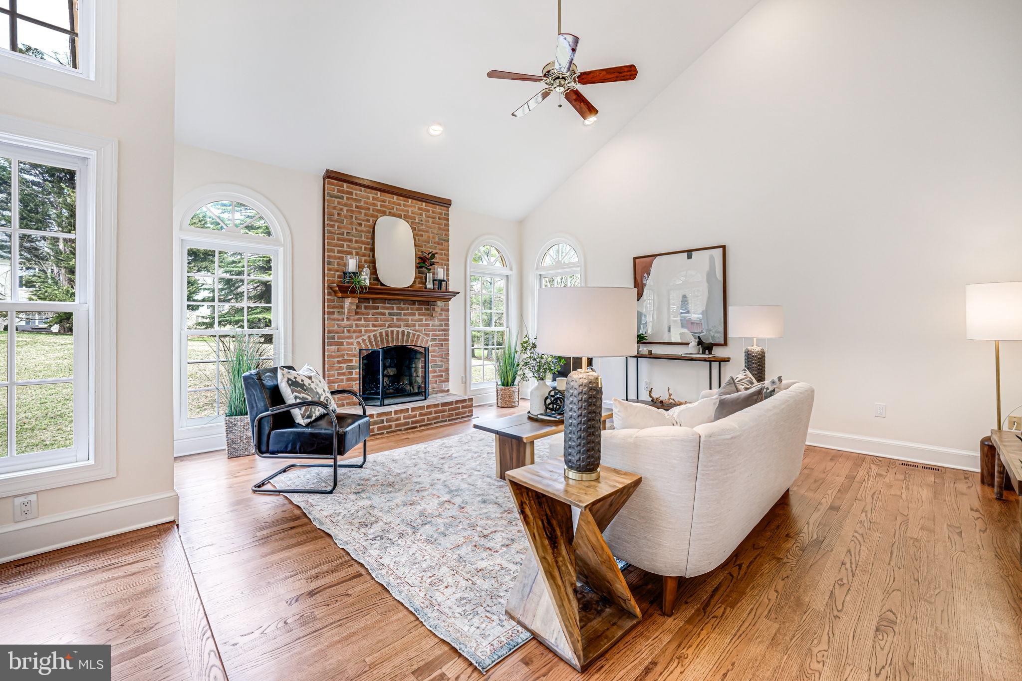 10800 Tradewind Drive Oakton, VA 22124 - Photo 13 of 77 a living room with furniture fireplace and window
