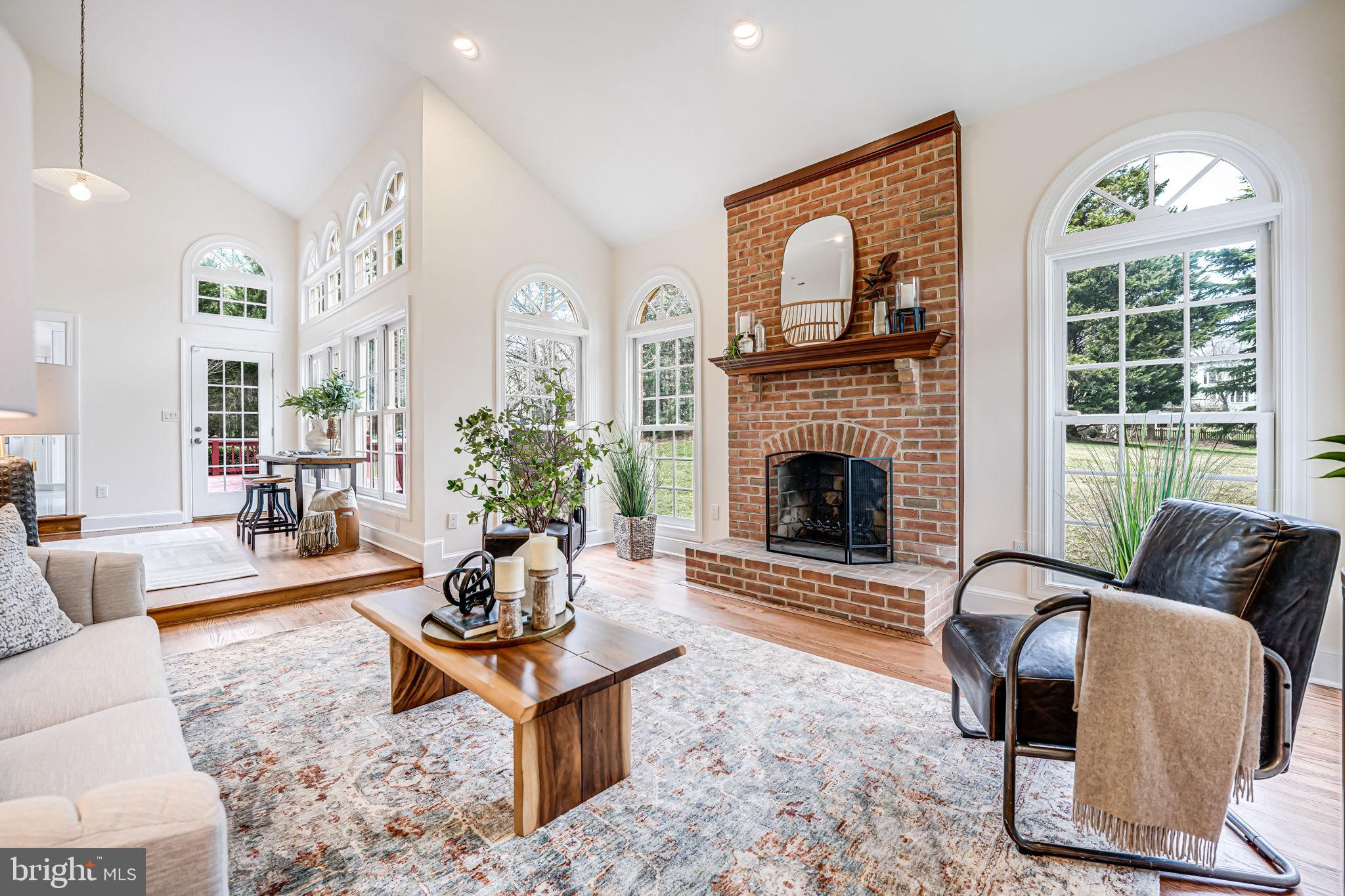 10800 Tradewind Drive Oakton, VA 22124 - Photo 15 of 77 a living room with furniture fireplace and window