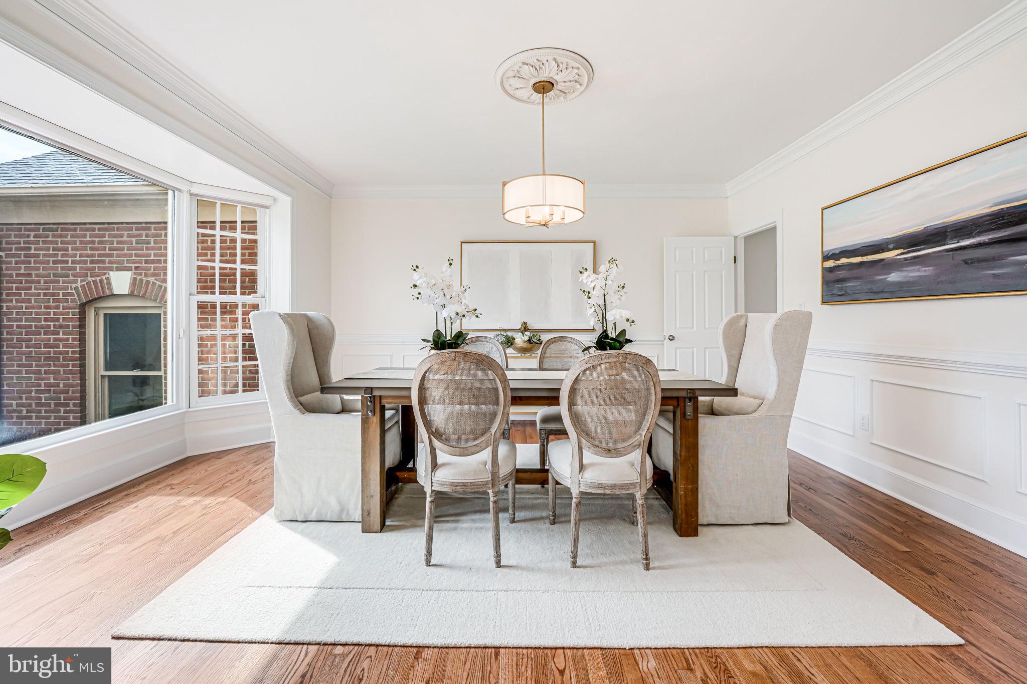 10800 Tradewind Drive Oakton, VA 22124 - Photo 19 of 77 a view of a dining room with furniture window and wooden floor