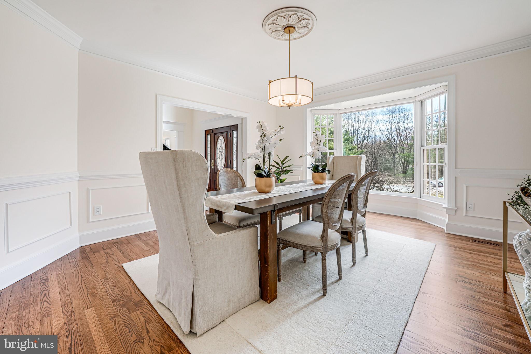 10800 Tradewind Drive Oakton, VA 22124 - Photo 20 of 77 a view of a dining room with furniture window and wooden floor