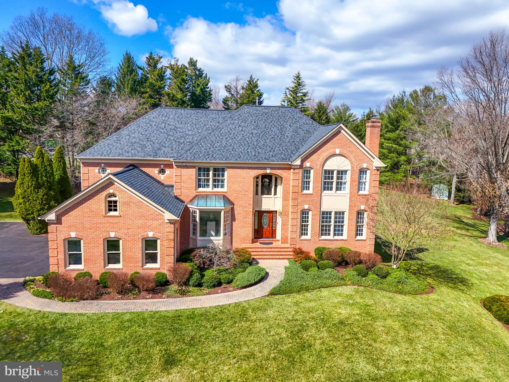 10800 Tradewind Drive Oakton, VA 22124 - Photo 2 of 77 a front view of a house with a yard