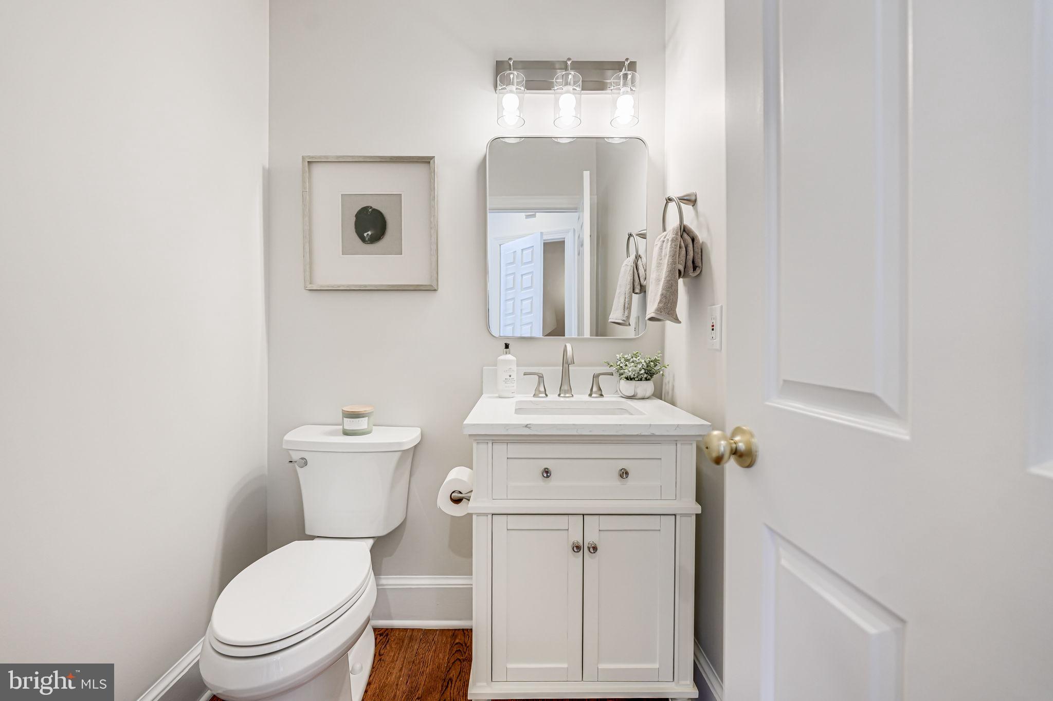 10800 Tradewind Drive Oakton, VA 22124 - Photo 21 of 77 a white toilet sitting next to a bathroom sink