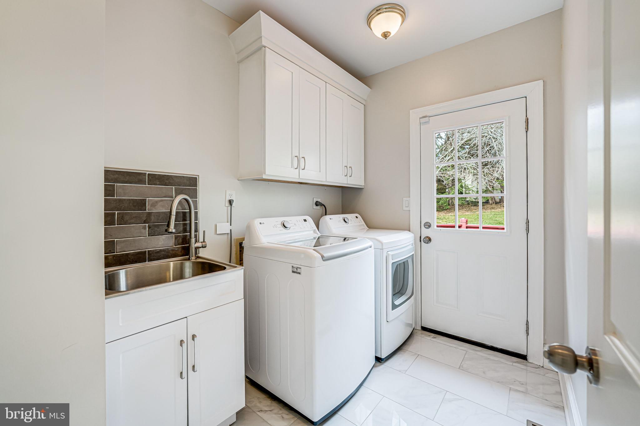 10800 Tradewind Drive Oakton, VA 22124 - Photo 30 of 77 a utility room with dryer and washer
