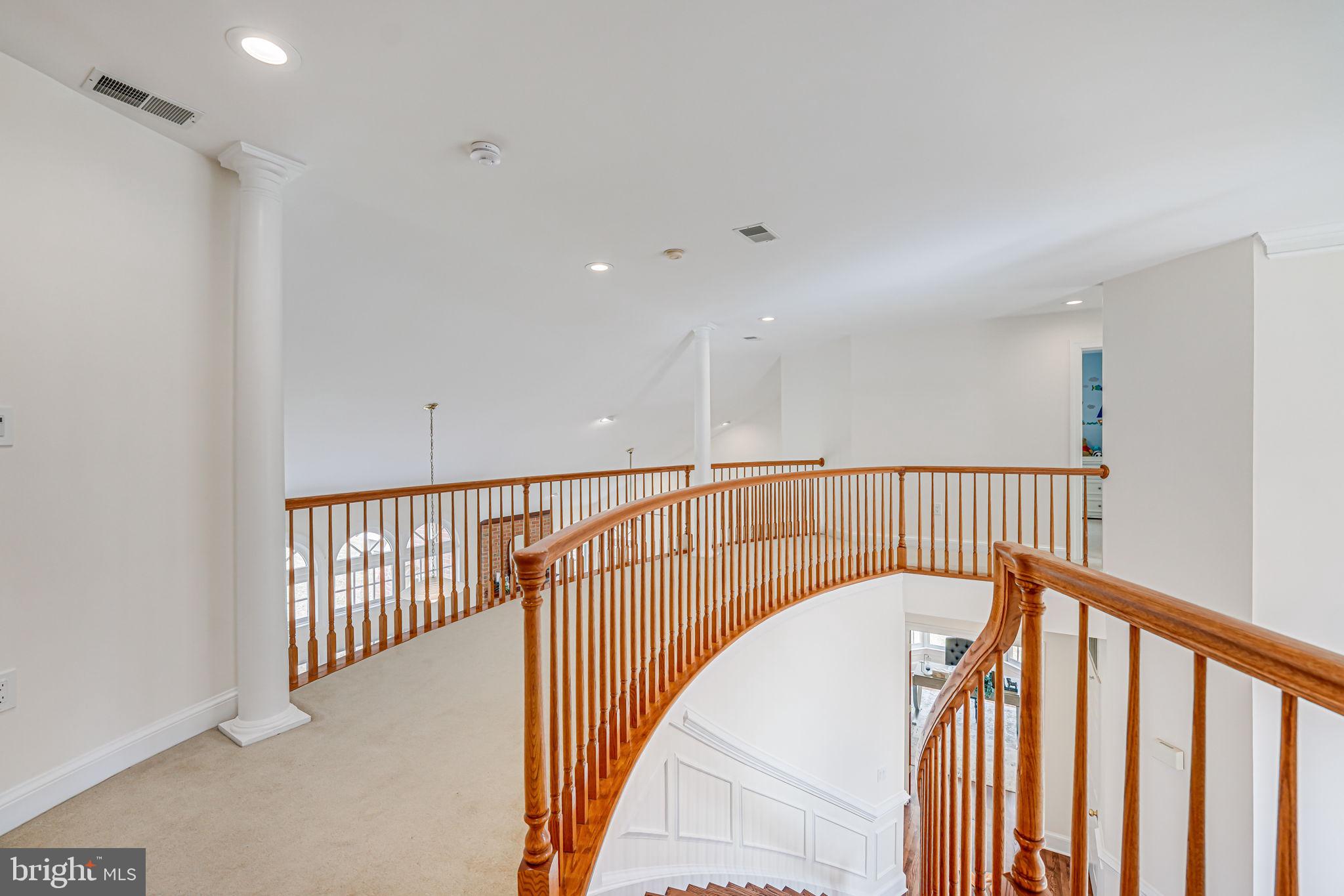 10800 Tradewind Drive Oakton, VA 22124 - Photo 31 of 77 a view of staircase with railing and white walls