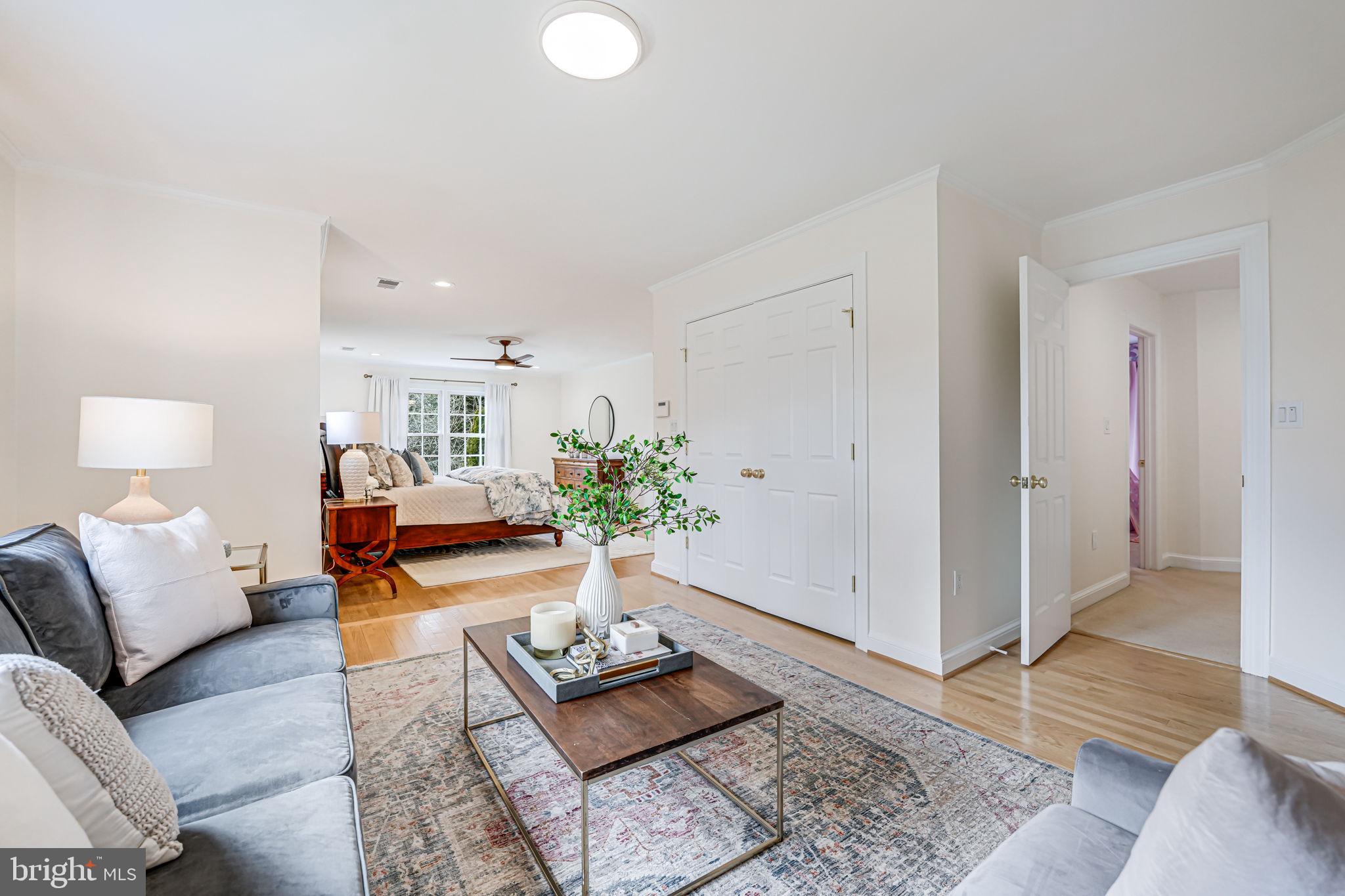 10800 Tradewind Drive Oakton, VA 22124 - Photo 33 of 77 a living room with furniture and wooden floor
