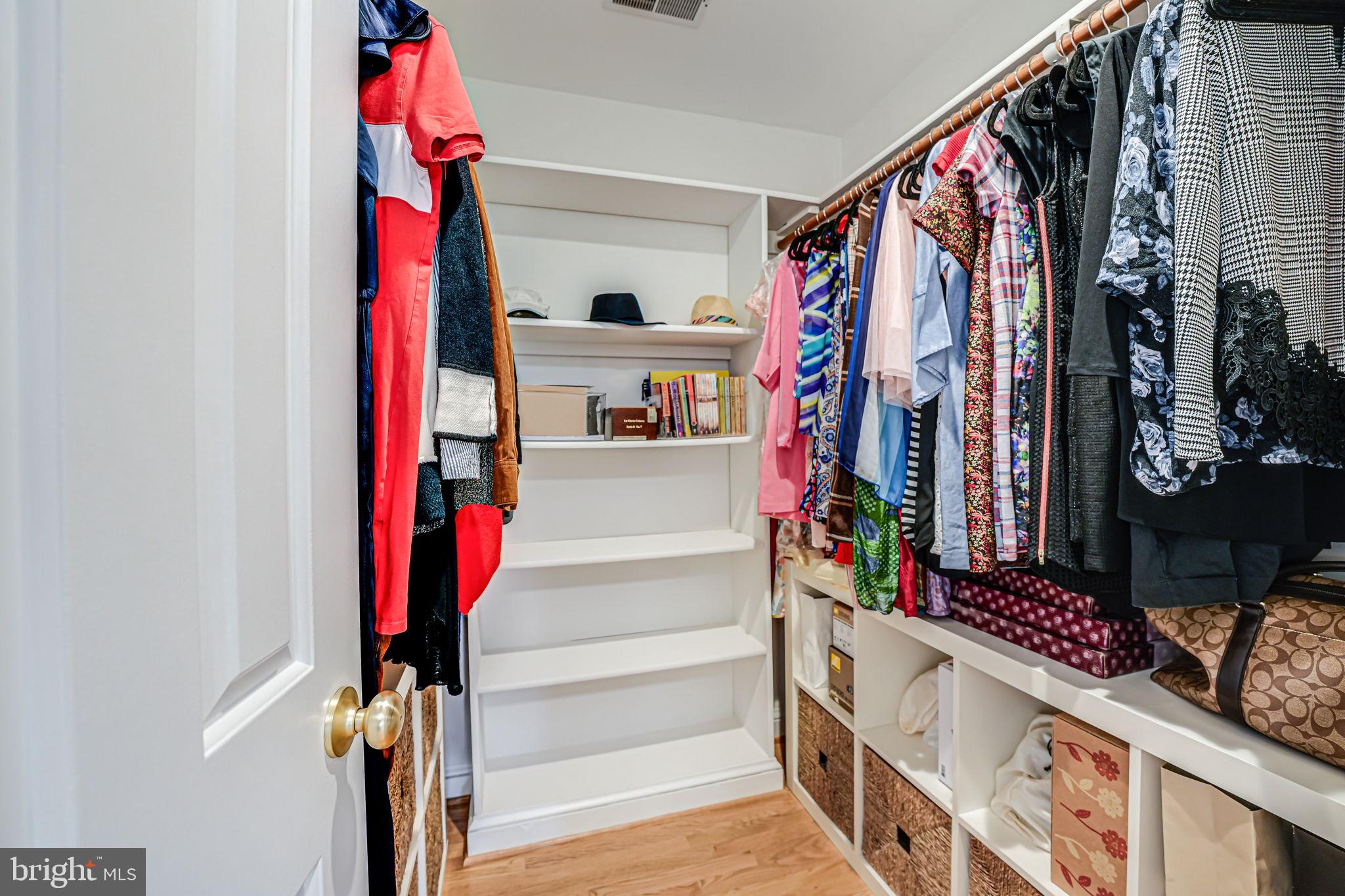 10800 Tradewind Drive Oakton, VA 22124 - Photo 39 of 77 a view of walk in closet with clothes and shoes