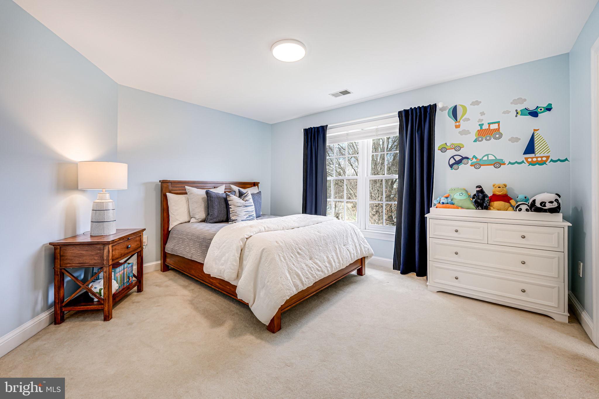 10800 Tradewind Drive Oakton, VA 22124 - Photo 46 of 77 a spacious bedroom with a bed and a window